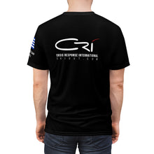Load image into Gallery viewer, Refugee Camp, Greece 2015- Unisex CRI shirt with Flag on sleeve

